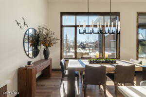Dining room featuring wood finished floors and a chandelier