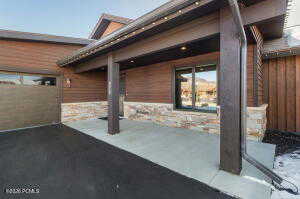 Snow covered patio featuring a patio