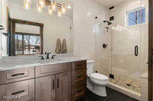 Bathroom with vanity and a shower stall