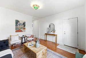 Living room with wood finished floors and baseboards