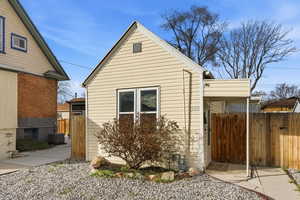 View of side of property featuring a cooling unit