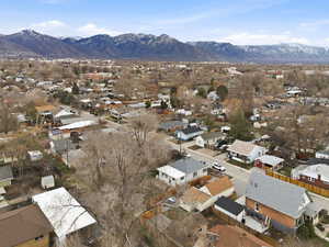 Aerial view of residential area featuring a mountain backdrop