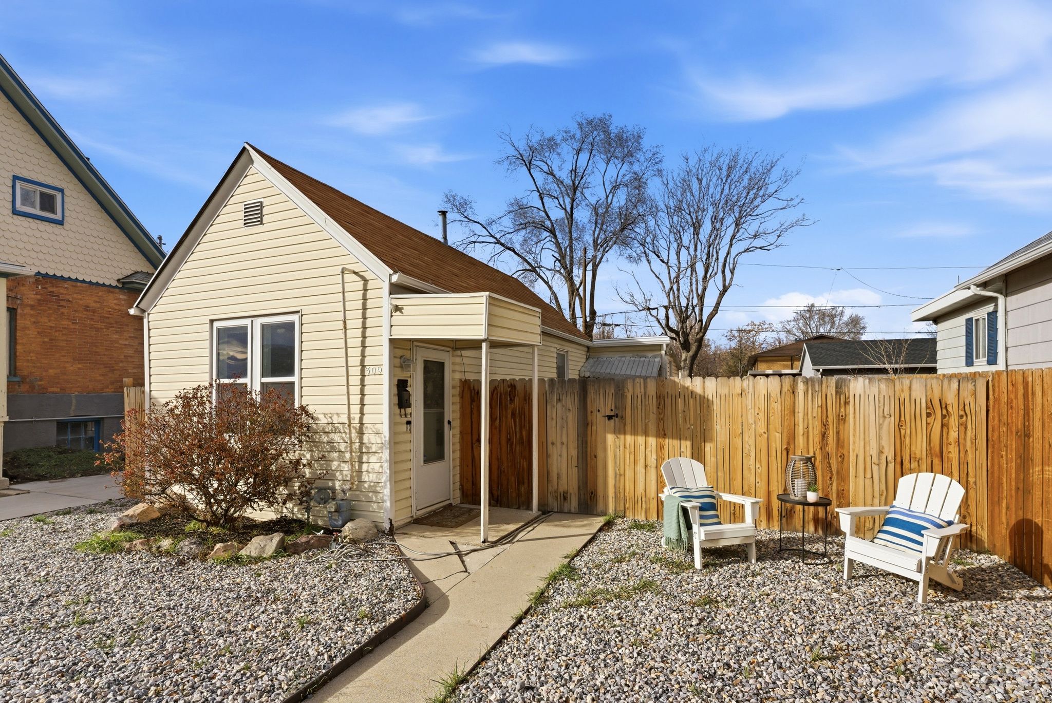 Back of property with a gate