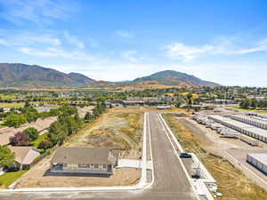 Aerial perspective of suburban area with a mountainous background