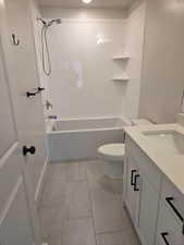 Bathroom with vanity and tub / shower combination