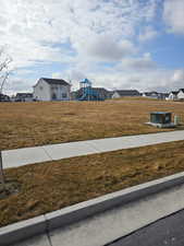 View of grassy yard with a residential view
