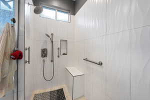 Full bath featuring a shower stall