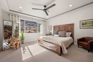 Bedroom featuring light colored carpet, a ceiling fan, and recessed lighting