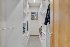 Primary bedroom walk in closet