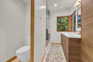 Primary bathroom featuring a custom walk in steam shower