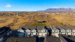 Aerial perspective of suburban area with a mountain backdrop