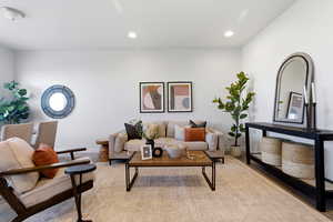 Living room with recessed lighting and light wood-style flooring