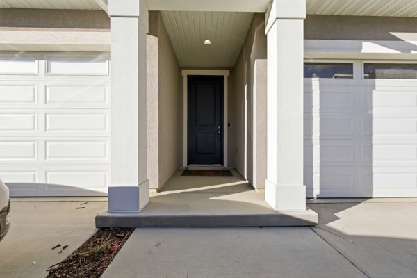 Property entrance with a garage
