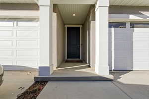 Property entrance with a garage