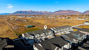 Aerial perspective of suburban area with a mountainous background