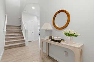 Entryway featuring light wood-style floors and recessed lighting