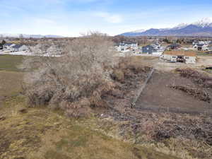Aerial view of residential area featuring a mountainous background