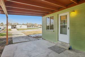 Covered porch featuring a residential view and entry steps