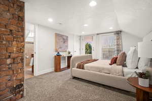 Carpeted bedroom with a textured ceiling, access to outside, and recessed lighting