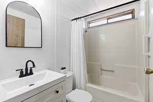 Full bath featuring vanity and shower / bath combo