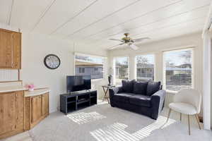 Living room featuring a ceiling fan