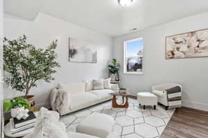 Living room featuring baseboards and wood finished floors