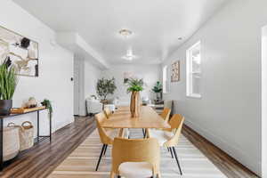 Dining space with wood finished floors and baseboards