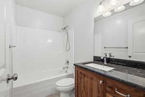 Bathroom featuring vanity and shower / washtub combination