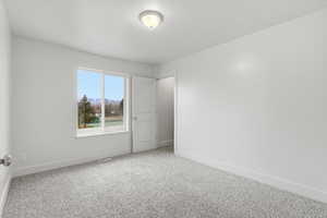 Carpeted bedroom with baseboards