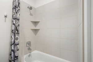 Full bathroom featuring shower / tub combo