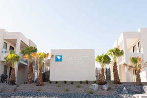 Community / neighborhood sign with a balcony