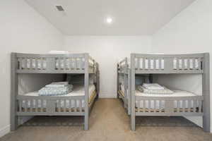 Bedroom with light carpet