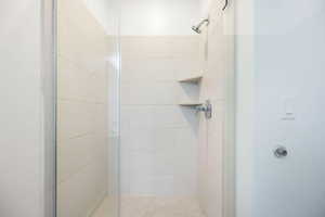 Full bath with a shower stall