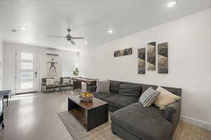 Living area featuring a ceiling fan, a mini split for heating / cooling, and recessed lighting