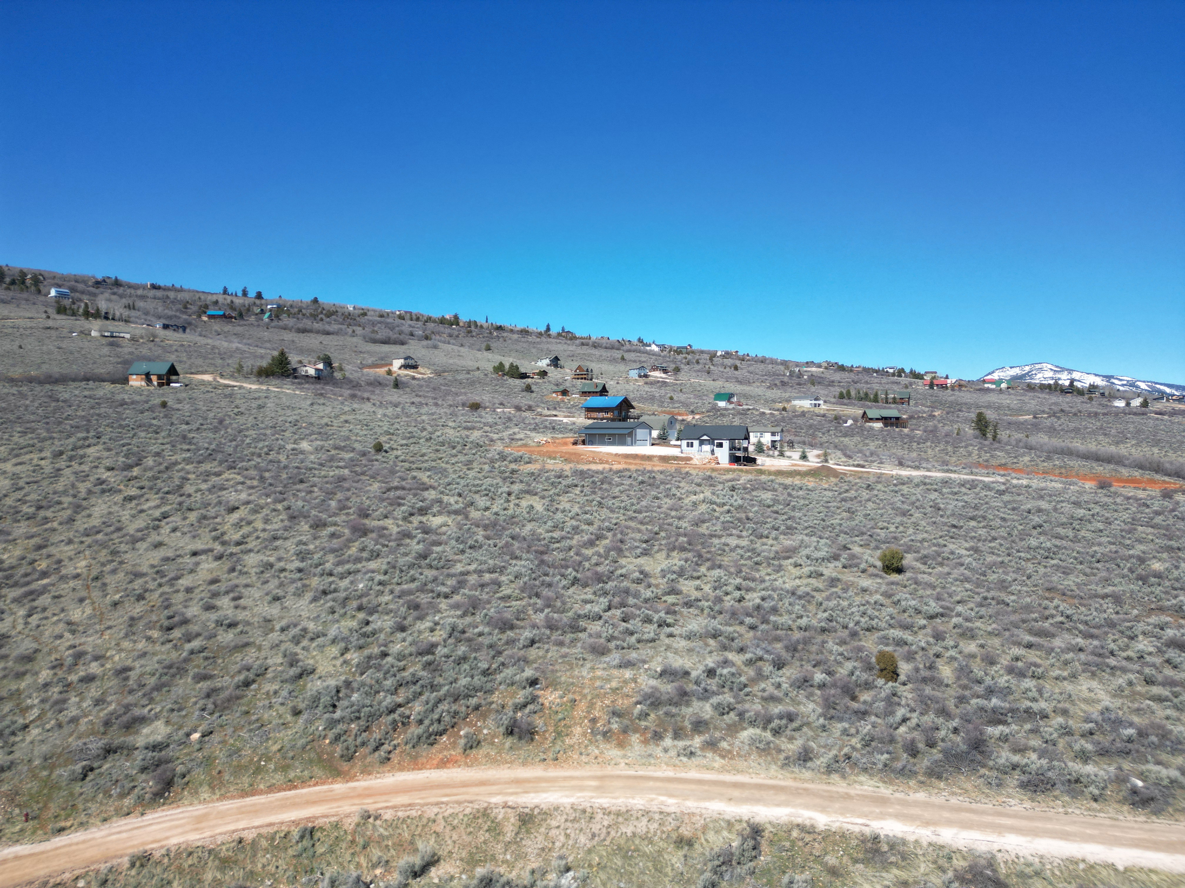 View of yard with view of desert and a mountain view