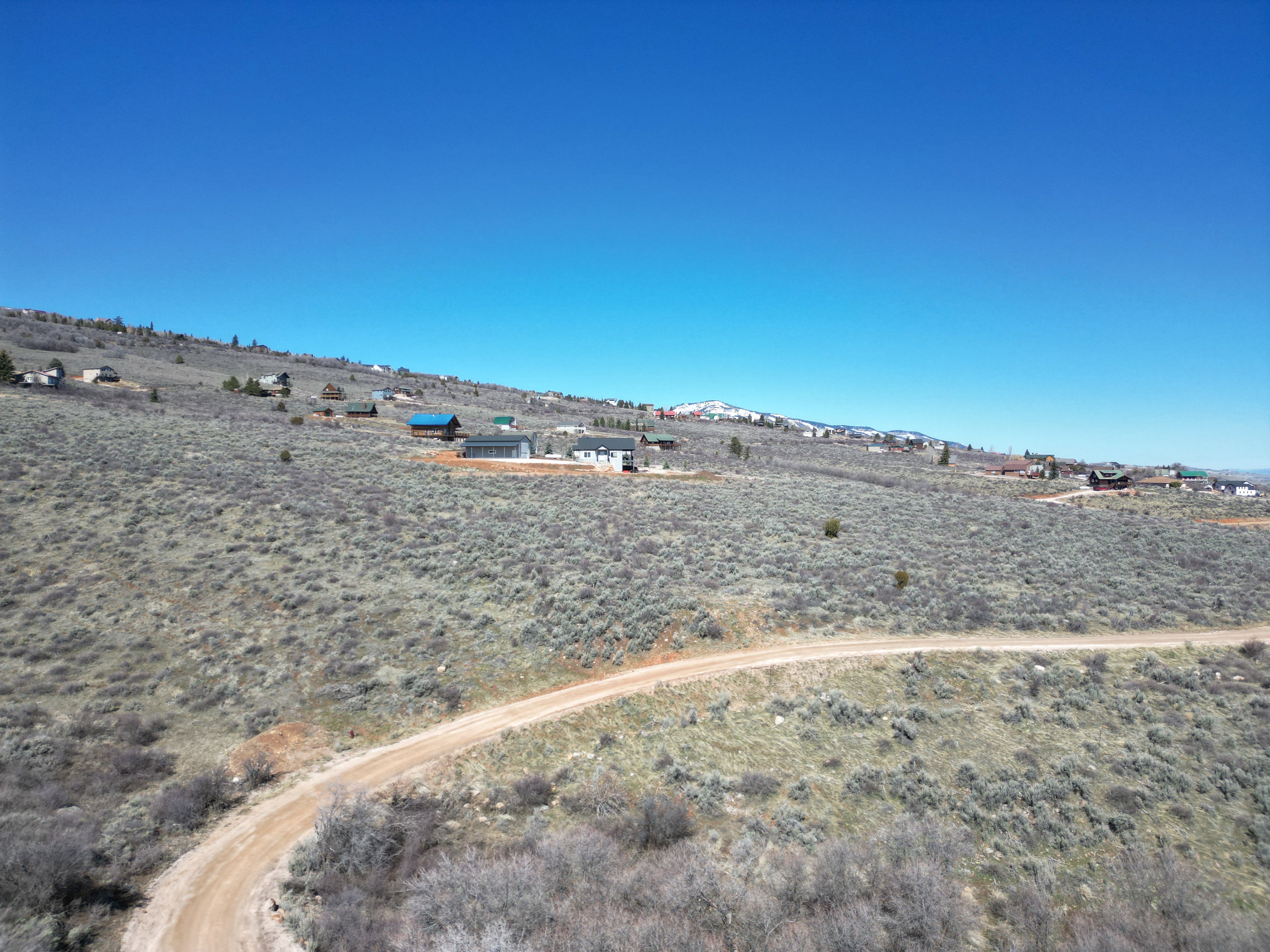 View of yard with a mountain view and a rural view