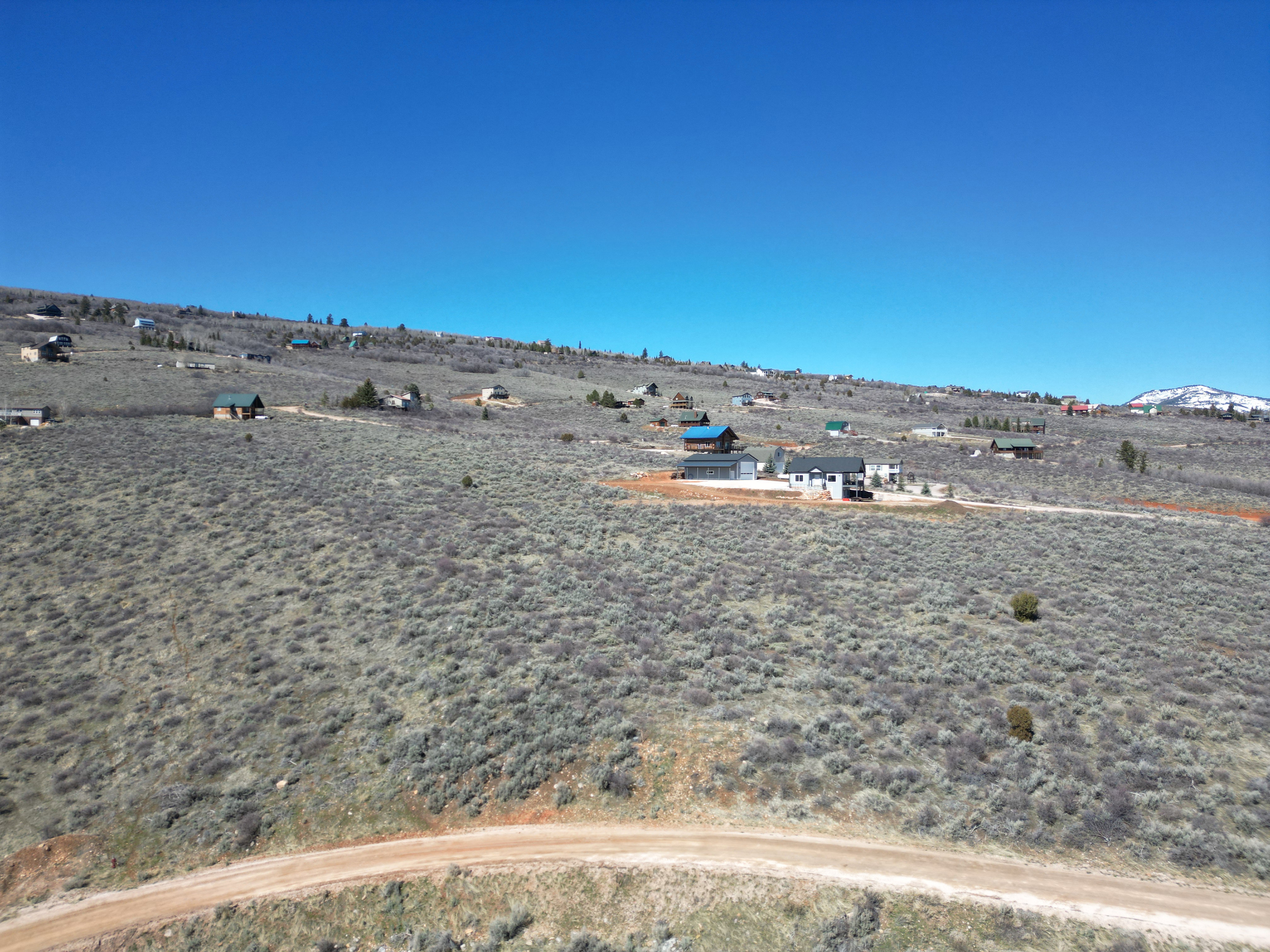 View of yard with view of desert landscape and a mountain view