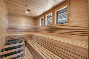 Sauna with wood walls and wood ceiling