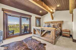 Bedroom featuring a wooden ceiling with exposed beams, light carpet, recessed lighting, and access to outside