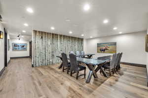 Dining area with recessed lighting and light wood-style flooring