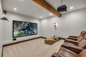 Home theater room featuring beam ceiling, carpet floors, and recessed lighting