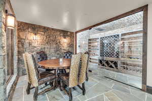 Wine room with light stone finish flooring