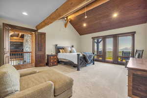 Bedroom featuring access to outside, a mountain view, recessed lighting, light carpet, and vaulted ceiling