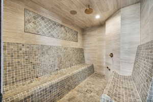 Bathroom featuring recessed lighting and a tile shower