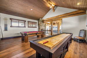 Rec room featuring a high wooden beamed ceiling, hardwood / wood-style floors, and billiards