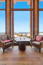 Sitting room with a mountain view and hardwood / wood-style flooring
