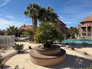 Community pool with a patio
