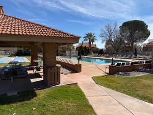 Community pool with a patio