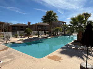 Community pool featuring a patio area