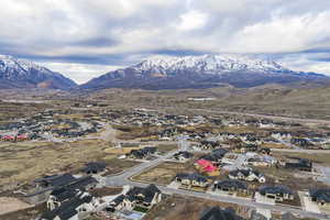 Aerial perspective of suburban area featuring a mountain backdrop